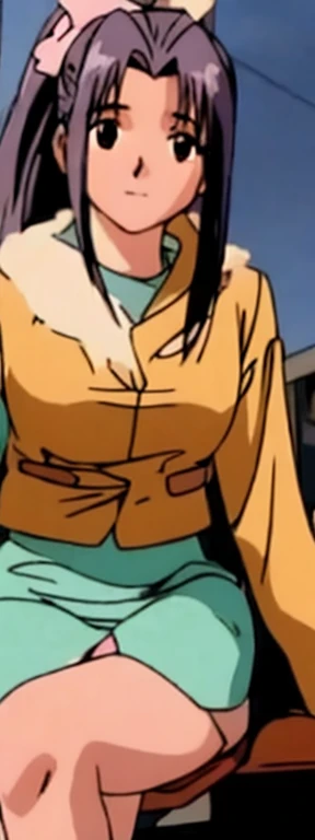 Momoko Koigakubo is sitting wearing a coat。