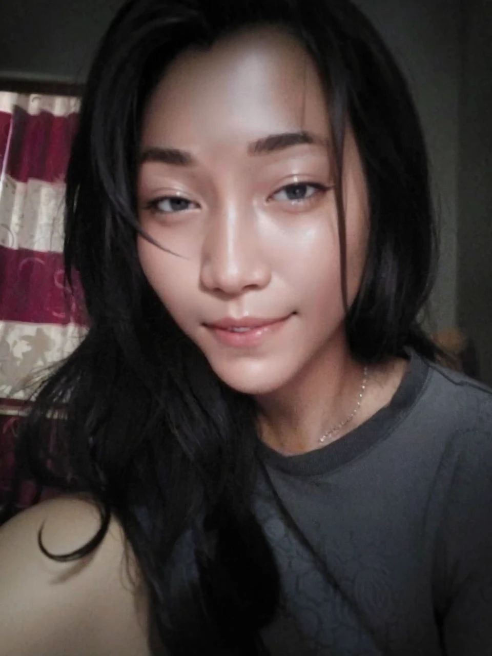 View from below selfie, 26 year old girl, beautiful, quite cuby, Philippines, wearing plain cream colored slimfit tees, curvy:0.7, brownish black hair flowing slightly messy to the front