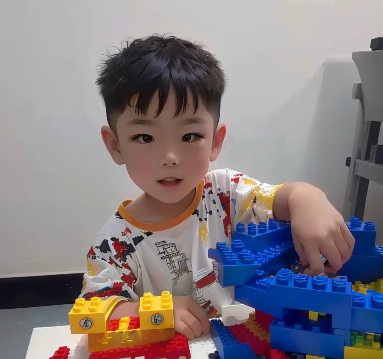 there is a young boy playing with a large set of Legos, child, Lego, Lego style, Toddlers, building 块, , childs toy, child们's toy, High-quality video, plastic toys, 2 years old, dcture, child们, Inspired by teachers, Lego