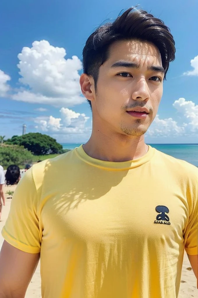 A handsome, muscular young Asian man looks at the camera. In a plain yellow t-shirt , Fieldside, grass, beach, sunlight