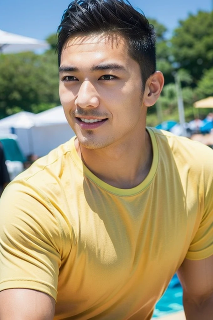 A handsome, muscular young Asian man looks at the camera. In a plain yellow t-shirt , Fieldside, grass, beach, sunlight