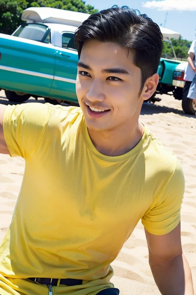 A handsome, muscular young Asian man looks at the camera. In a plain yellow t-shirt , Fieldside, grass, beach, sunlight