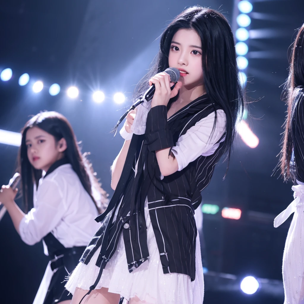 A black-haired girl with white strands performs on stage