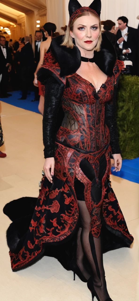 Woman in cat costume wearing a beautiful black and red dress at the met gala