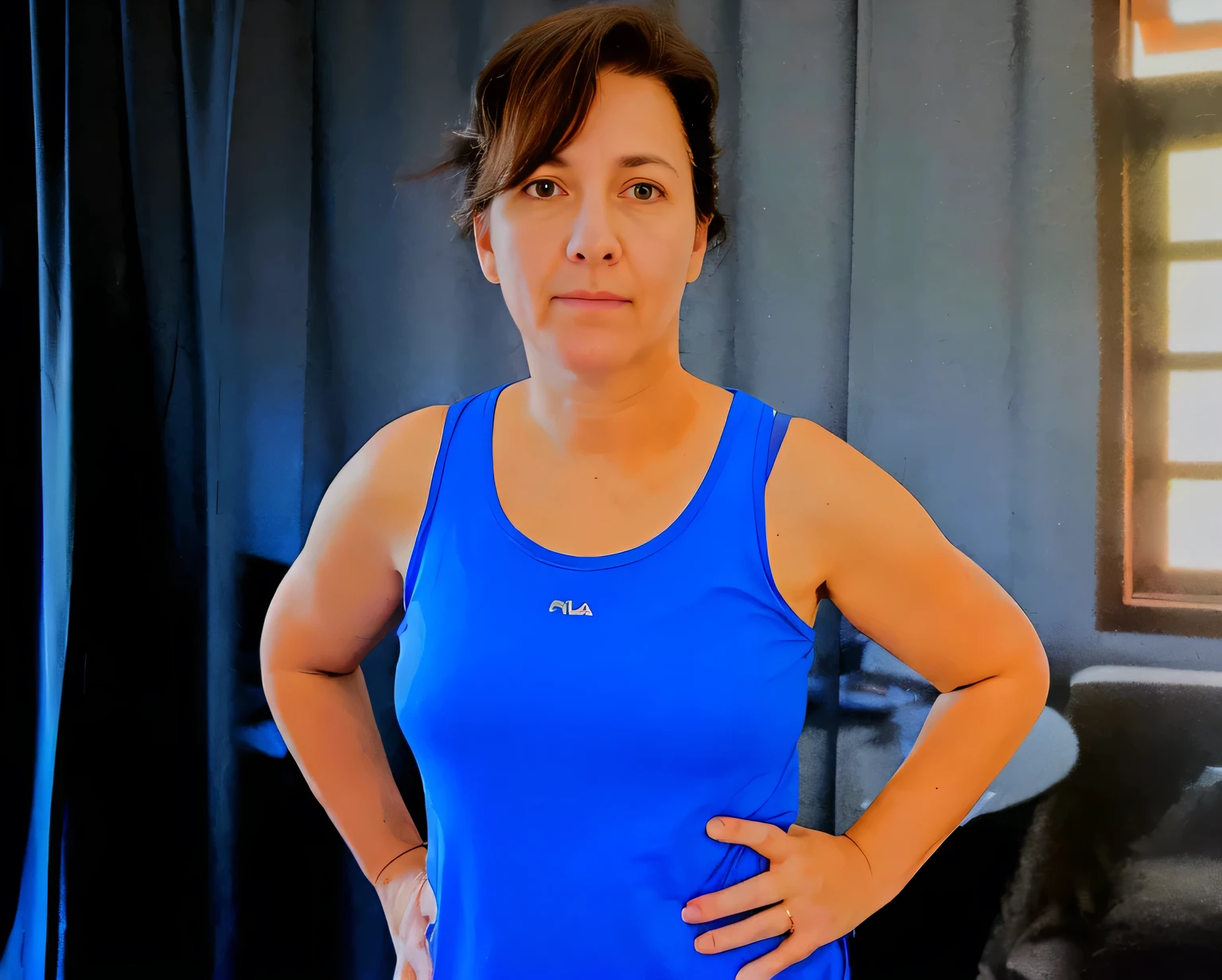 there is a woman standing in a room with a blue tank top, pilar, profile image, wearing fitness gear, by Gina Pellón, fit pic, magalie villeneuve, by Amelia Peláez, hunched shoulders, frontal pose, arms crossed on chest, magda torres gurza, sandra chevier, front portrait, carola rubio