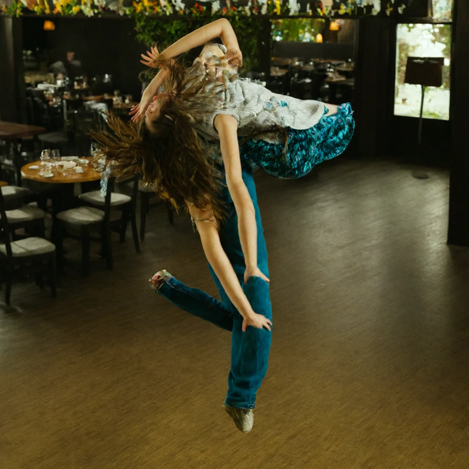 A GIRL DANCING IN A RESTAURANT