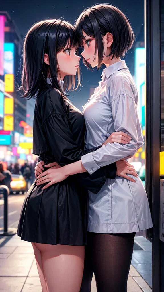 Two girls looking at each other passionately in the city at night.
One of the girls has short hair , half shaved. The other girl has long black hair.