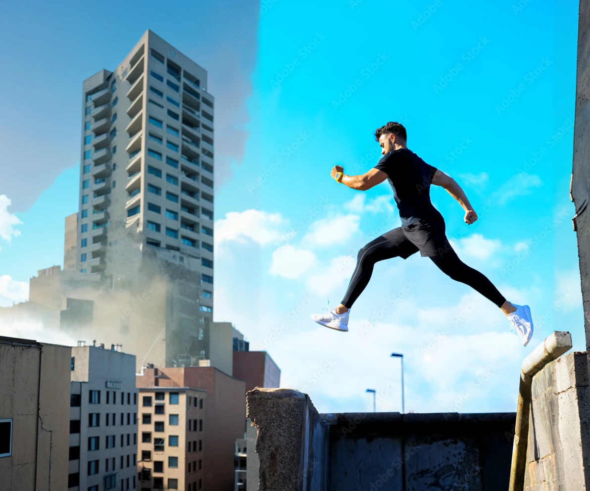 Man jumping over buildings