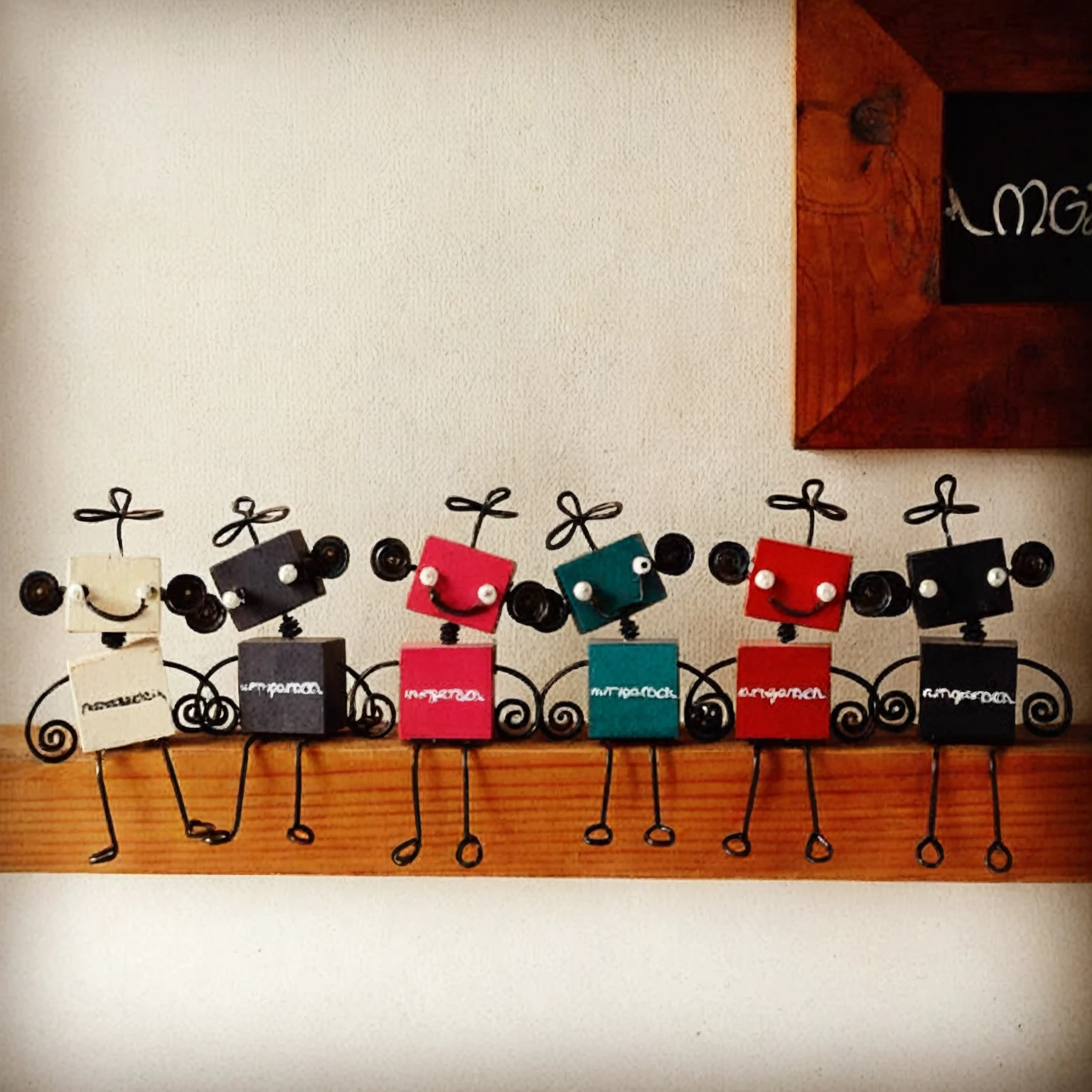 there are many small metal Figures of people on a shelf, small robot, Figures, metal robot, Metal Art, Stick Figures, Wooden Art Toy with Base, robot, かわいいrobot木製, Characters in the Masinarium, ティントイ キャラクターデザイン robot, cartoonish and simplistic, tiny robot, Marcos Restrepo, Named, Mouse fork, Ötzi