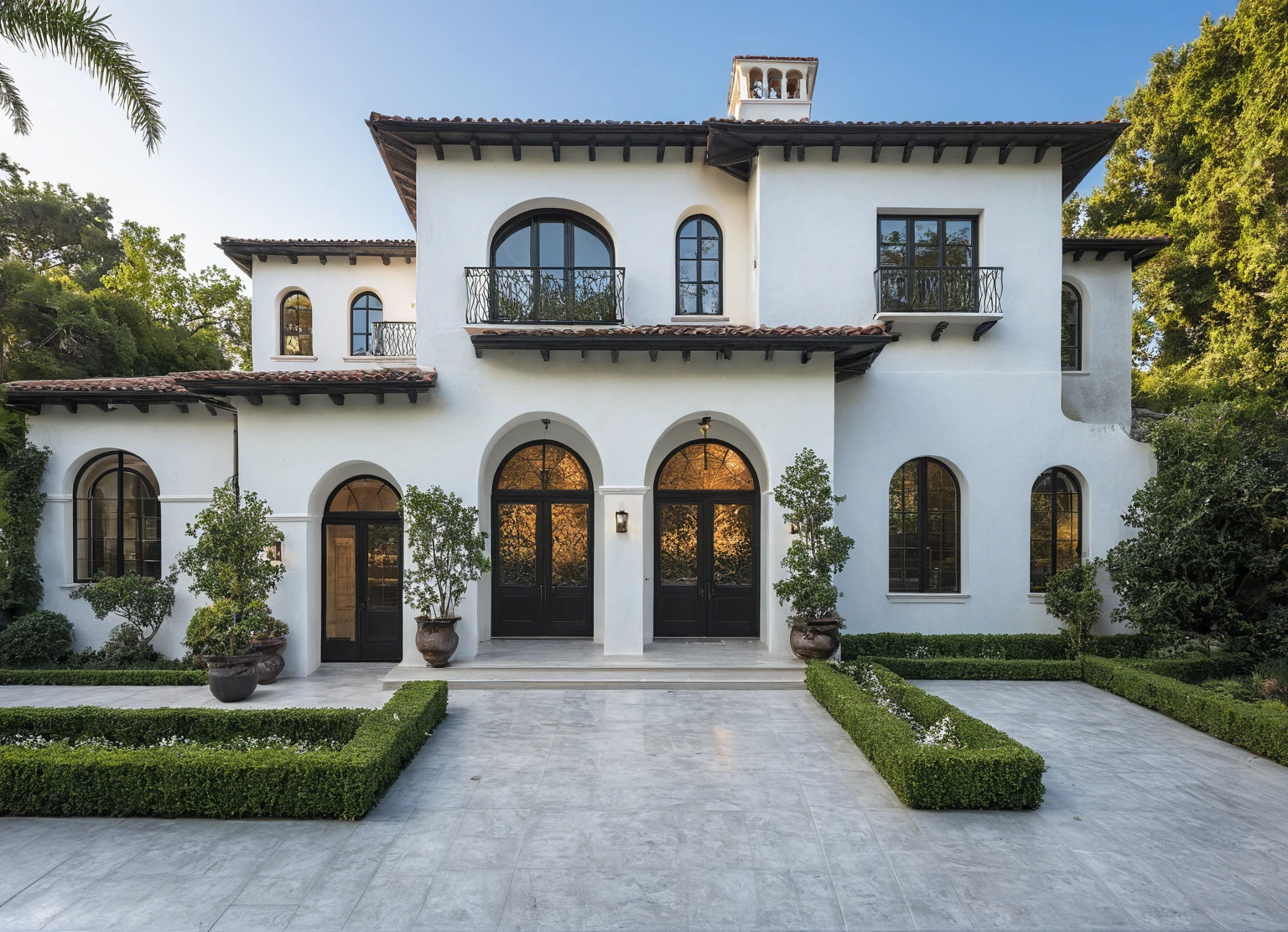 (RAW photo, masterpiece, best quality,ultra-detailed, extremely delicate and beautiful, highresolution, best shadow:1.1), A Mediterranean Italian style home with white stucco walls, black accents and windows, large front yard, vivid color, beautiful shrubs and flower, tropical tree and plants, professional photography in the style of an Italian classic home.