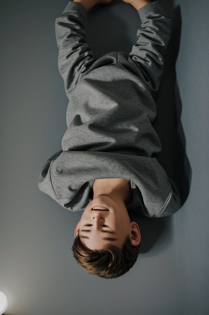 Boy on his back in gray sweatshirt with night light on transparent background