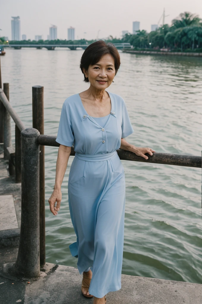 Khin Than Nu, RAW PHOTO, her name is Chariya, high quality, 1 old woman, ((58-year-old slim THAI woman)), (((58 years old))), ((slim body)), ((wrinkled body)), (((old body))), (((short hair))), she is wearing a fashionable stylish Generation X wear different colors, POSE: standing, BREAK, BACKGROUND: outdoor, Along the tranquil banks of the Chao Phraya River, film grain