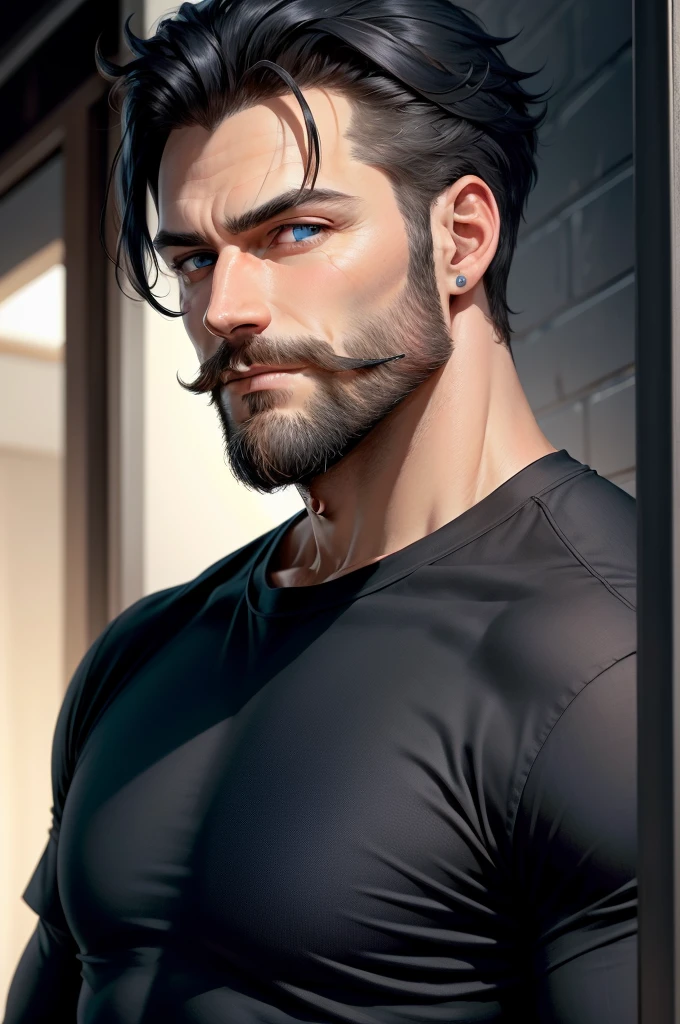 A man with blue eyes and a small beard and dark hair in a black shirt