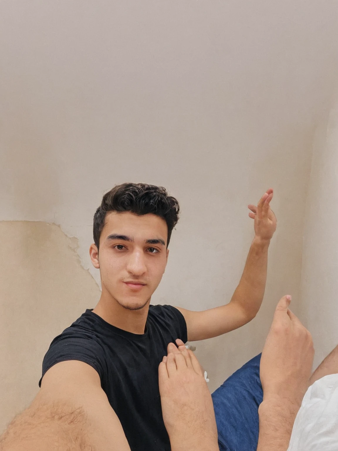 there is a man that is standing in a room with his hand up, ismail, 2 3 years old, 2 2 years old, enes dirig, 21 years old, 8k selfie photograph, young greek man, ahmad merheb, 18 years old, headshot profile picture, 2 4 years old, mohamed chahin, sam nassour, his palms are sweaty his palm raised