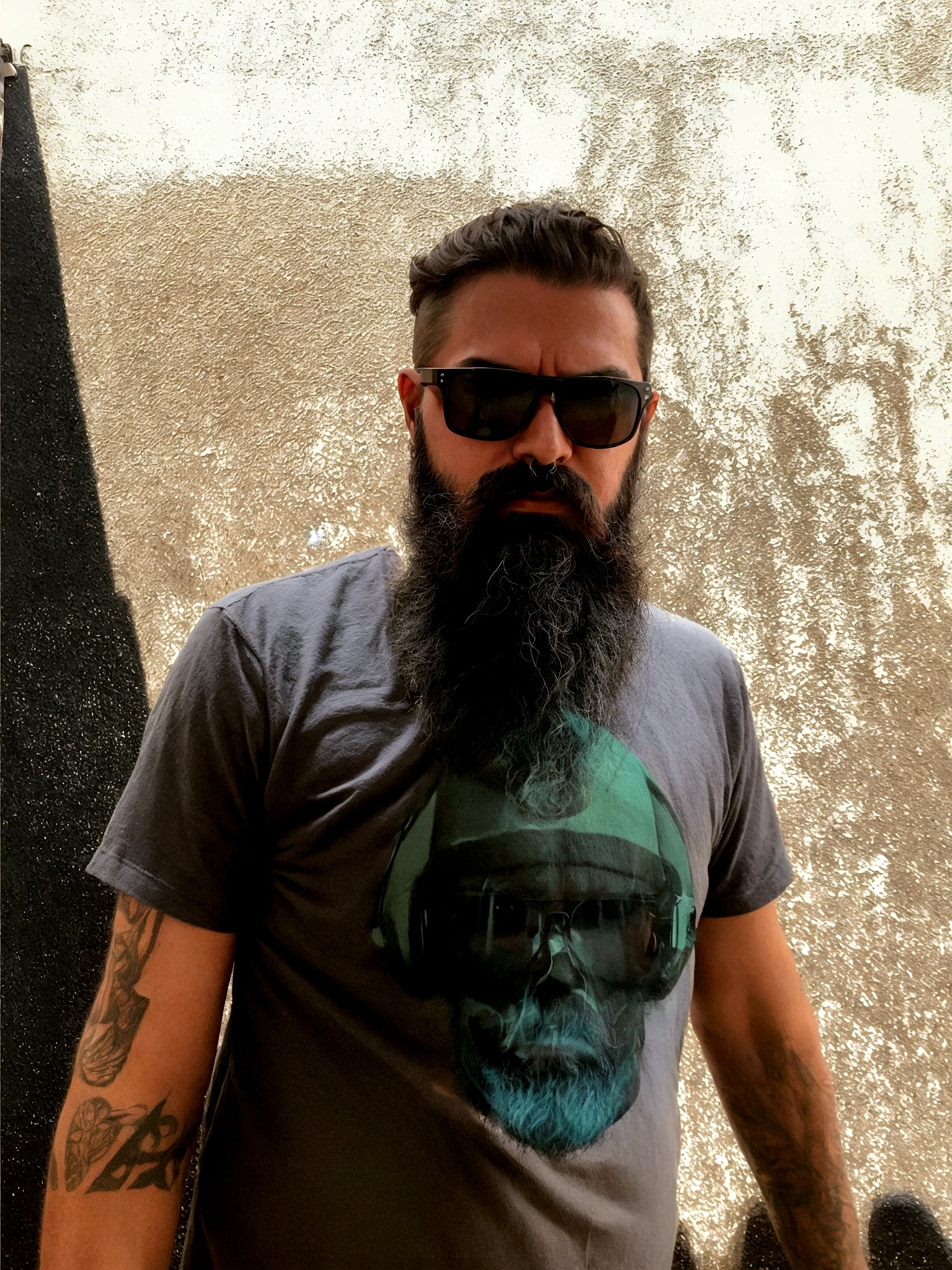 man with long beard, short hair wearing sunglasses