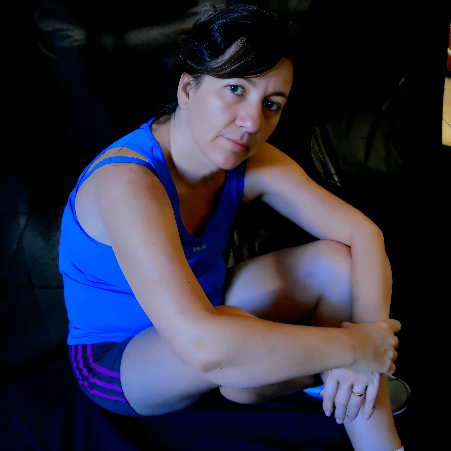 there is a woman sitting on a couch with a remote in her hand, tired half closed, muscular and exhausted woman, sweating, side portrait, sandra chevier, portait photo, sitting on bent knees, portait image, portrait of rugged adult female, low-key, portrait image, profile image, tense look, mid shot portrait, photo portrait