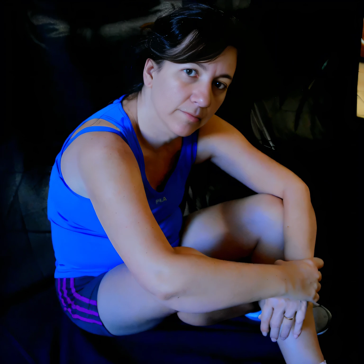there is a woman sitting on a couch with a remote in her hand, tired half closed, muscular and exhausted woman, sweating, side portrait, sandra chevier, portait photo, sitting on bent knees, portait image, portrait of rugged adult female, low-key, portrait image, profile image, tense look, mid shot portrait, photo portrait