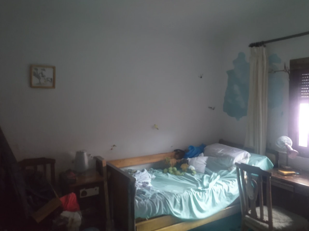 Make the back wall a mirror and reflect what is in the room, the reflected side is flooded with turquoise water, There are some things floating and some fish that are not very appreciated.
