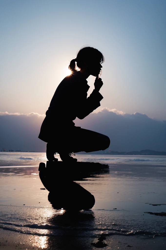 Silhouette of a crying person kneeling on their side