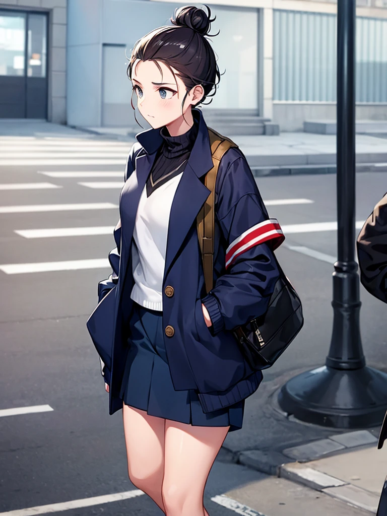 Street style: Girl with messy bun wearing oversized navy jersey jacket, urban setting
