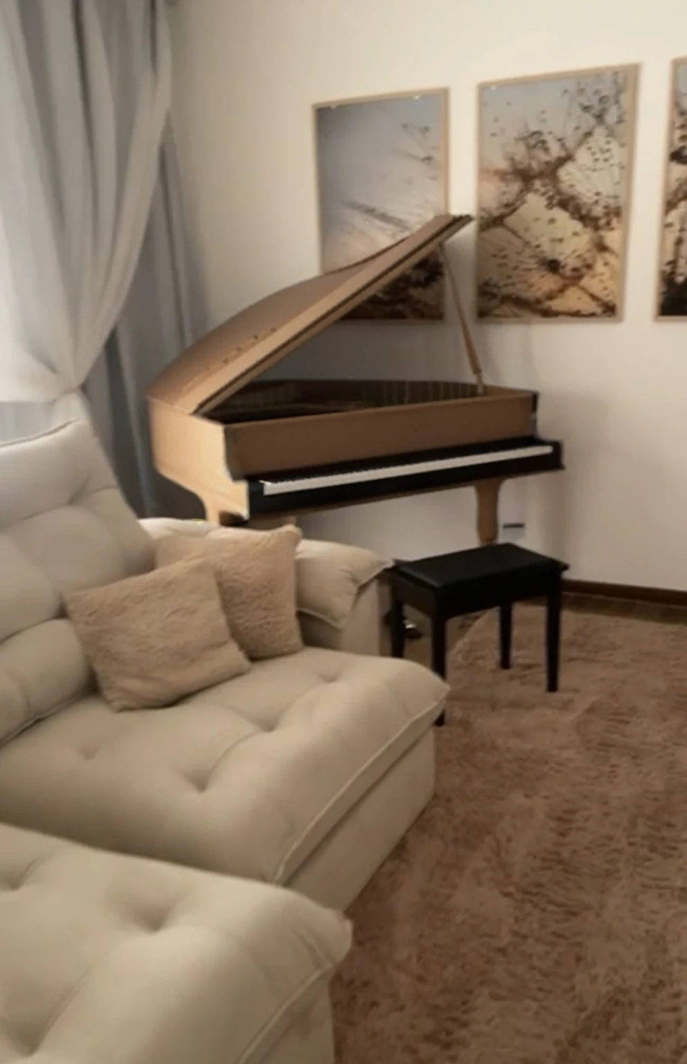 There is a couch and a piano in a living room, piano in the background, full piano, placed in a large living room, grand piano, placed in a living room, piano, ((Nobody) A highly detailed, extremely realistic, and photorealistic portrait of a beautiful room hyper realistic photography in very high quality. FUHD+. Perfect photo. (((Perfect elements and identical the upload image):1.4. Realistic photography:1.3, . ((( Living room with sofa and a beautiful elegant black grand piano)):1.5. Photography. best quality photography . Perfect room. , (wallpaper), conceptual art to hyper realistic image, intricate details, highly detailed, ((cinematic:1.4)), dramatic, (extremely-high-quality:1.6, Granted, masterpiece:1.5), (very-photorealistic:1.5 ), realistic photo, Nikon, natural light, 8k, high definition, processing:1.4, popular on CGStation, HDR 2160, High quality, 16k, 8K, only-male:1.5, captured with a Nikon camera using a 50mm lens, natural light, and high-quality post-processing in Adobe Lightroom and other photography software. The image is of the highest quality, with an 8K resolution and maximum detailing in a living room, cozy environment, real pianos, an art student's apartment, unreal engine; romantic theme, location in an apartment