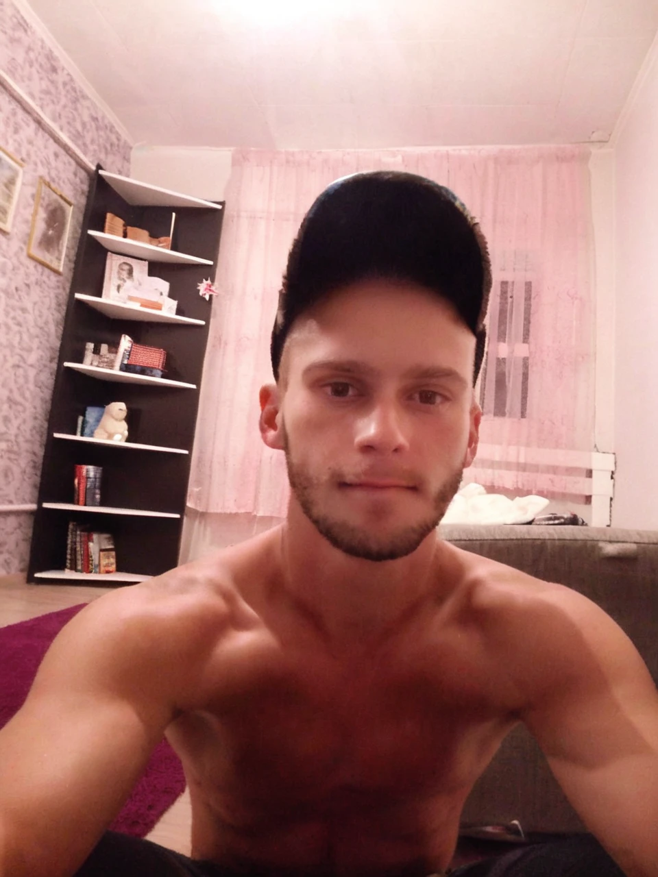 Guy about 27 years old, alone in the photo, short hair, brown eyes, no clothes, gopnik athletic body, bare arms, arms raised, armpits visible, white background, front, no scenery, looking at the viewer, upper body, facing the viewer, monochrome background, clean background, facing the camera, high resolution, white background, smirk on his face, vulgar face, dominant guy, smackdown