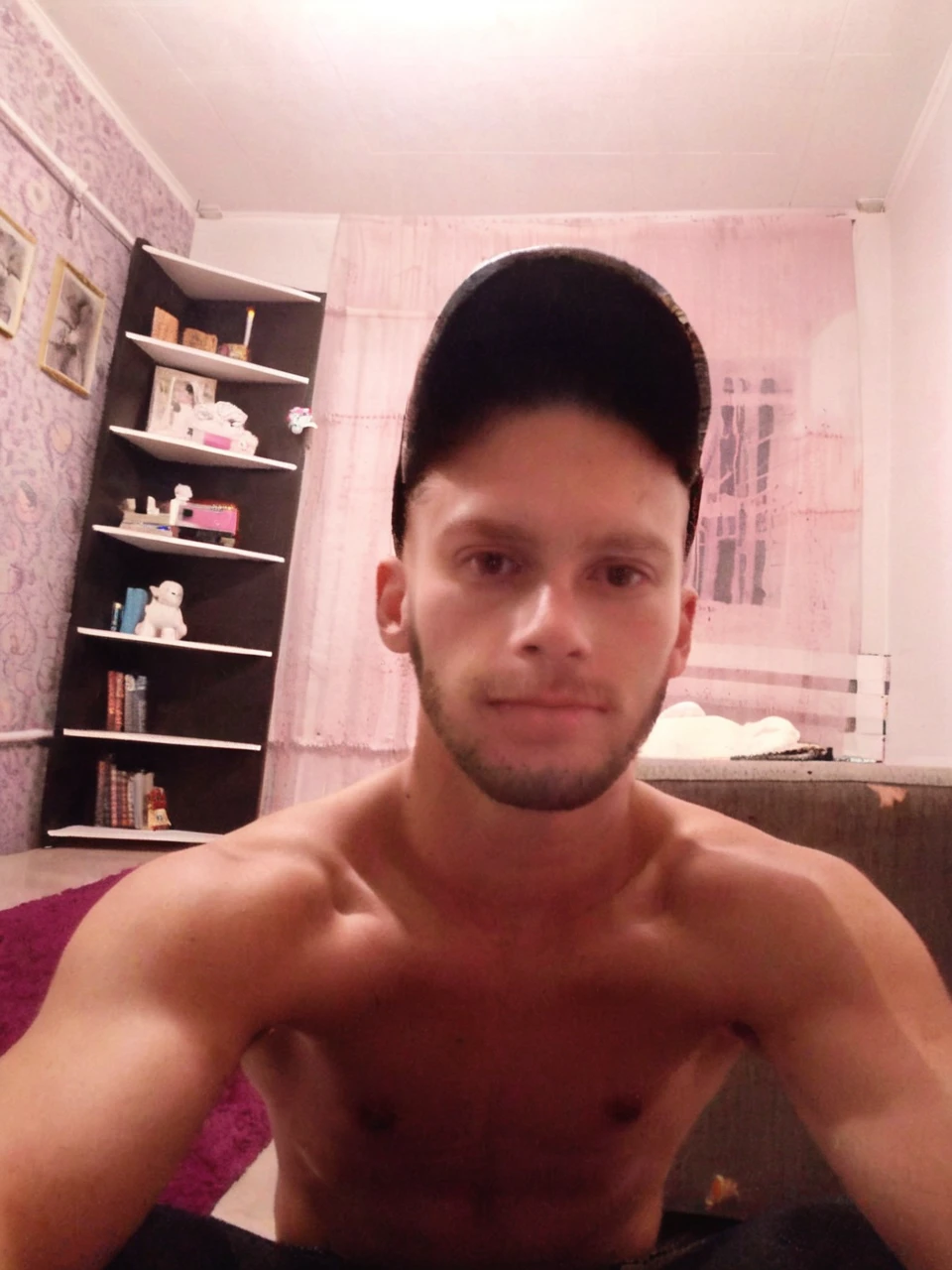 Guy about 27 years old, alone in the photo, short hair, brown eyes, no clothes, gopnik athletic body, bare arms, arms raised, armpits visible, white background, front, no scenery, looking at the viewer, upper body, facing the viewer, monochrome background, clean background, facing the camera, high resolution, white background, smirk on his face, vulgar face, dominant guy, smackdown