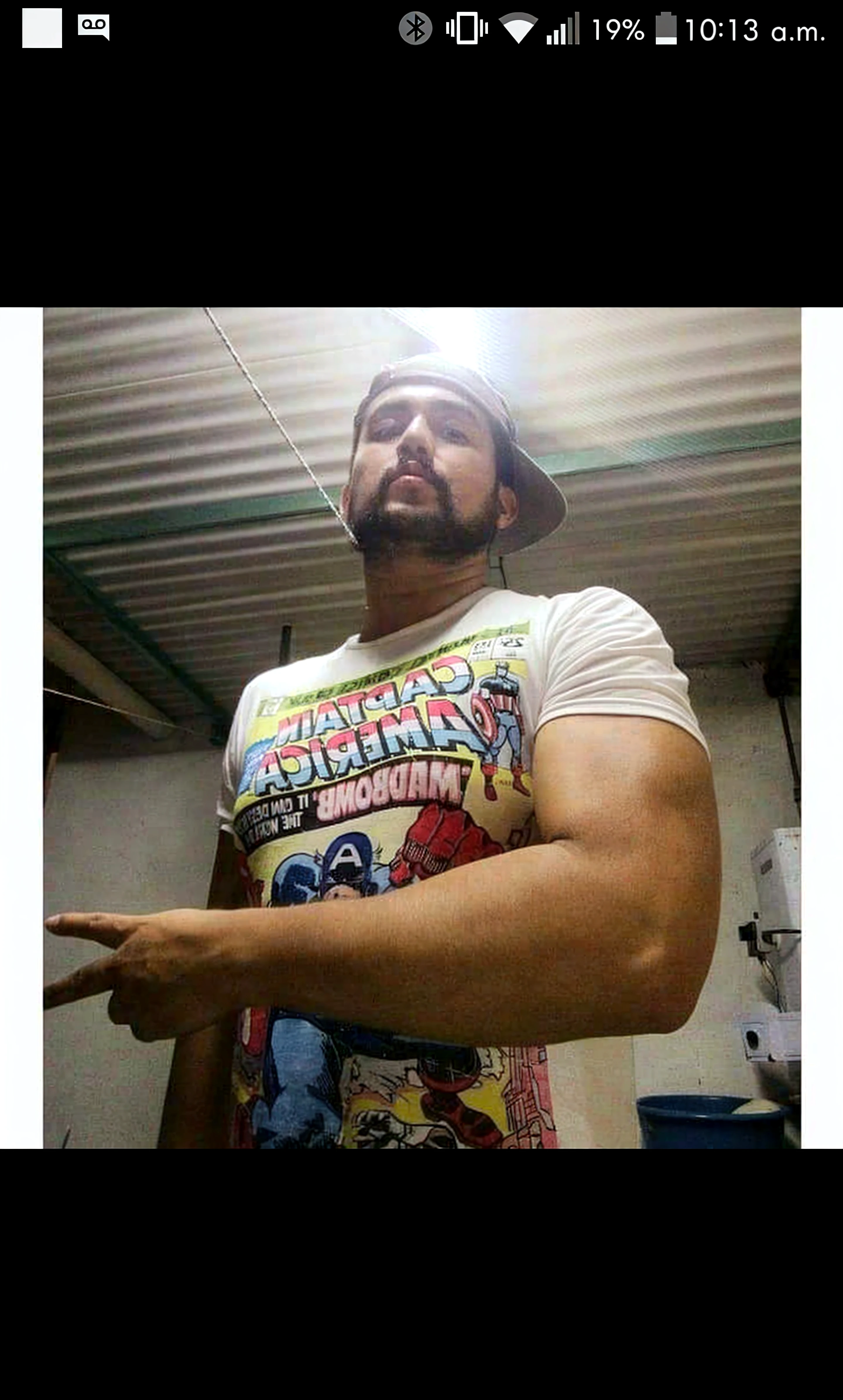 Latino chav, 20 years old, short hair, men, hairy, hairyalpha, BeardAlpha, wearing a superhero clothes, wearing a superhero cape, tight superhero uniform, oversized pectorals, heavy pectorals, oversized bulge, intimidating, smirking, nipple rings, angry, threatening, bara, prison background