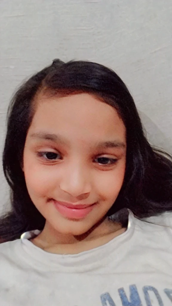 Indian face with pink baby lips adorable face and a mole on upper lips. Innocent skinny 13 years old girl with milk all over her clothes as she smiles.