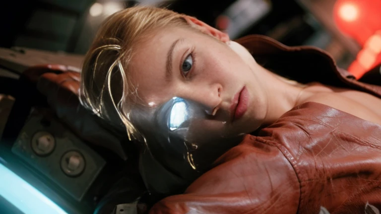 Blonde woman in leather jacket leaning against a wall with a neon light, Kristanna Loken, doom beautiful face,