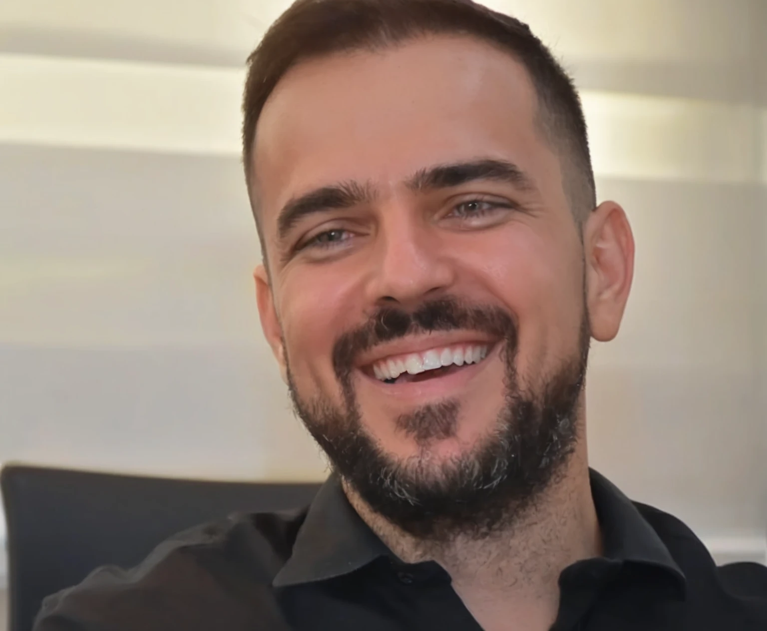 smiling man with beard and black shirt sitting on chair, henrique alvim corrêa, david rios ferreira, icaro carvalho, Ed Durmisevic, michael vicente, Marco Bucci, gui guimaraes, Luís Ricardo Falero, aykut aydogdu, toni infante, julian calle, Stefano Brunesci, edu souza