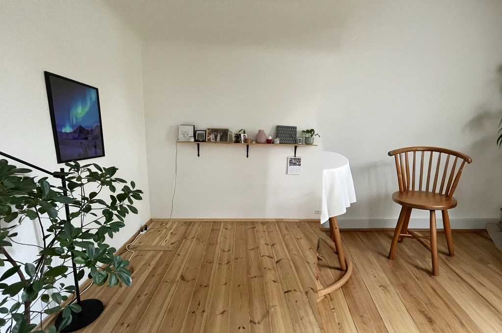small round wooden table with chairs