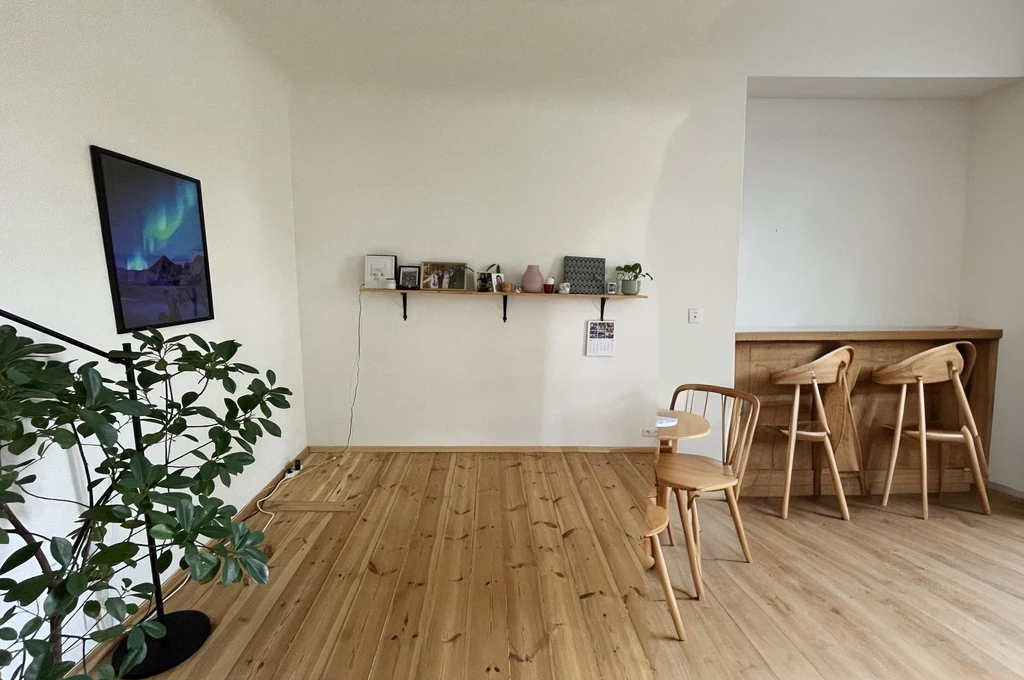 small round wooden table with chairs