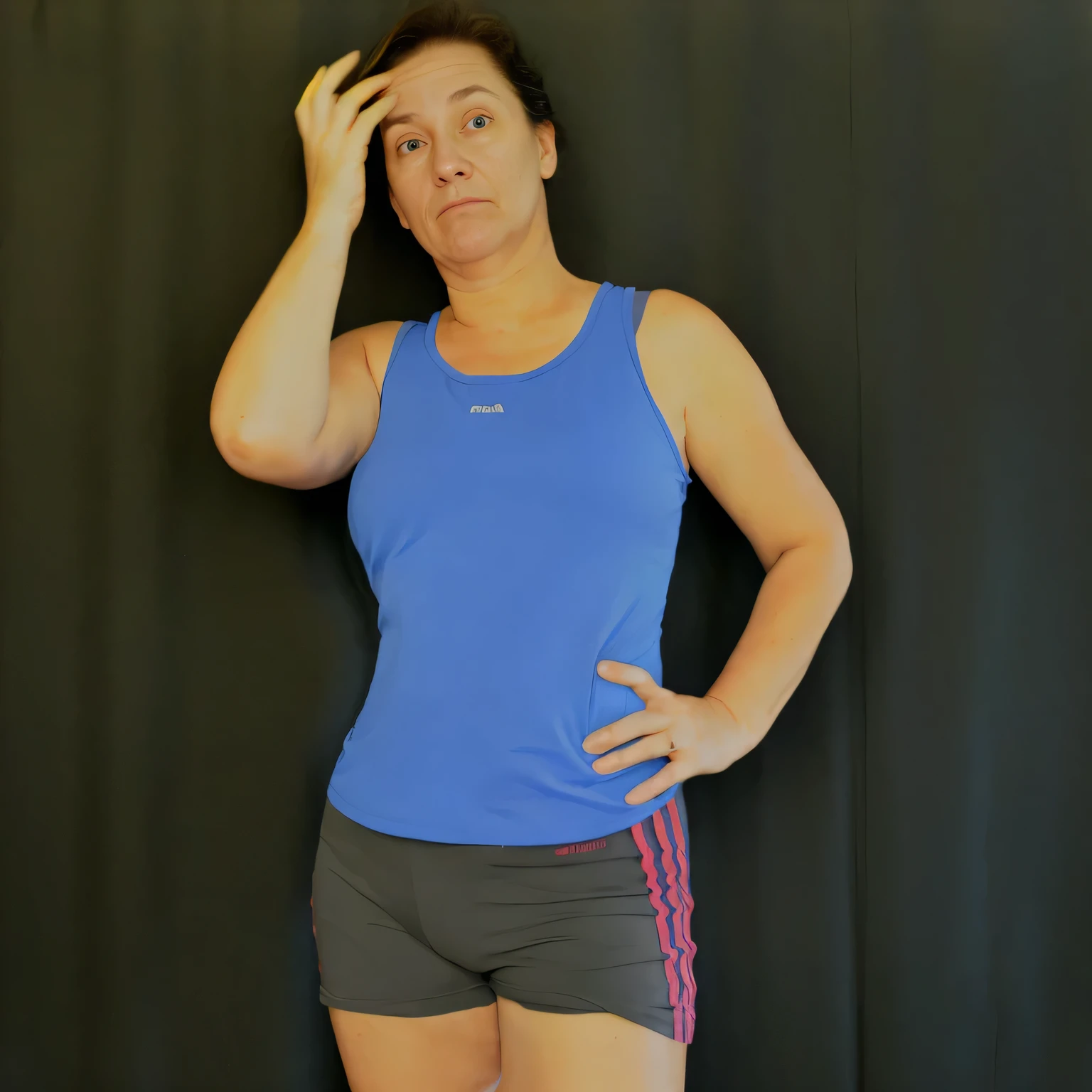 there is a woman in a blue tank top and gray shorts, wearing fitness gear, short robust woman, wearing a tank top and shorts, wearing : tanktop, frontal pose, wearing a camisole and shorts, sport bra and dark blue shorts, wearing adidas clothing, fit pic, wearing tanktop, half body photo, tired half closed