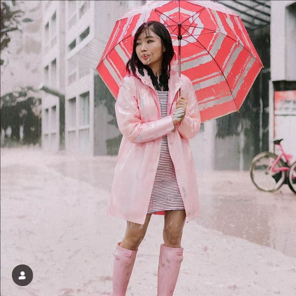 a beautiful asian woman holding a pink umbrella, cute pose, wearing a pink buttoned raincoat, tall pink rain boots, ((((muddy splatters)))), (((muddy raincoat))), (((mud dripping down clothes))) intricate details, highly detailed, masterpiece, 8k, photorealistic, cinematic lighting, vibrant colors, soft focus, elegant, feminine, beautiful, serene, graceful