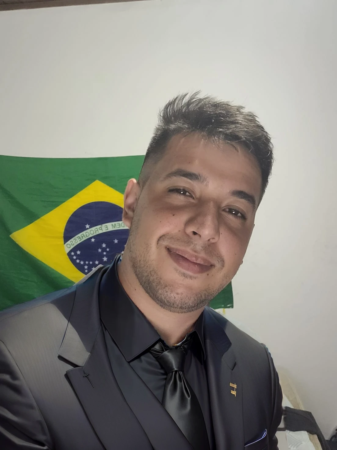 put on a black suit with a tie