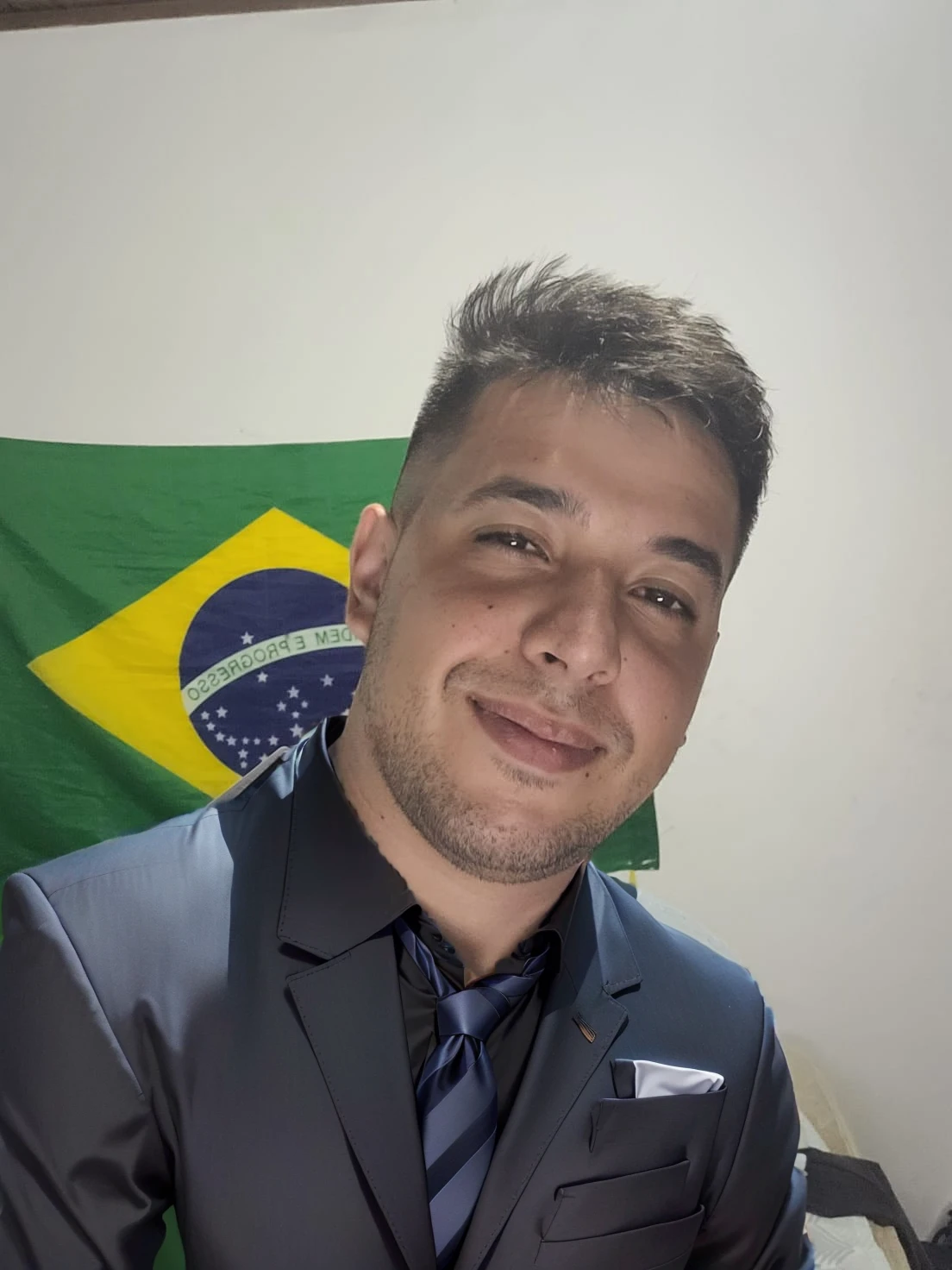 wear a black blazer with a white shirt and tie
