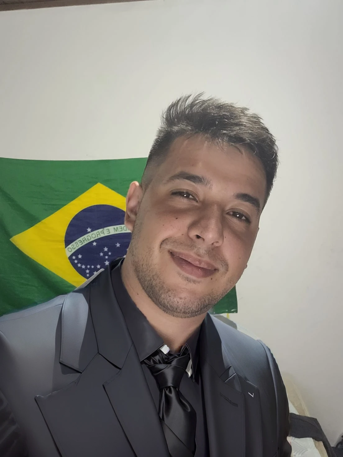 put on a black suit with a tie
