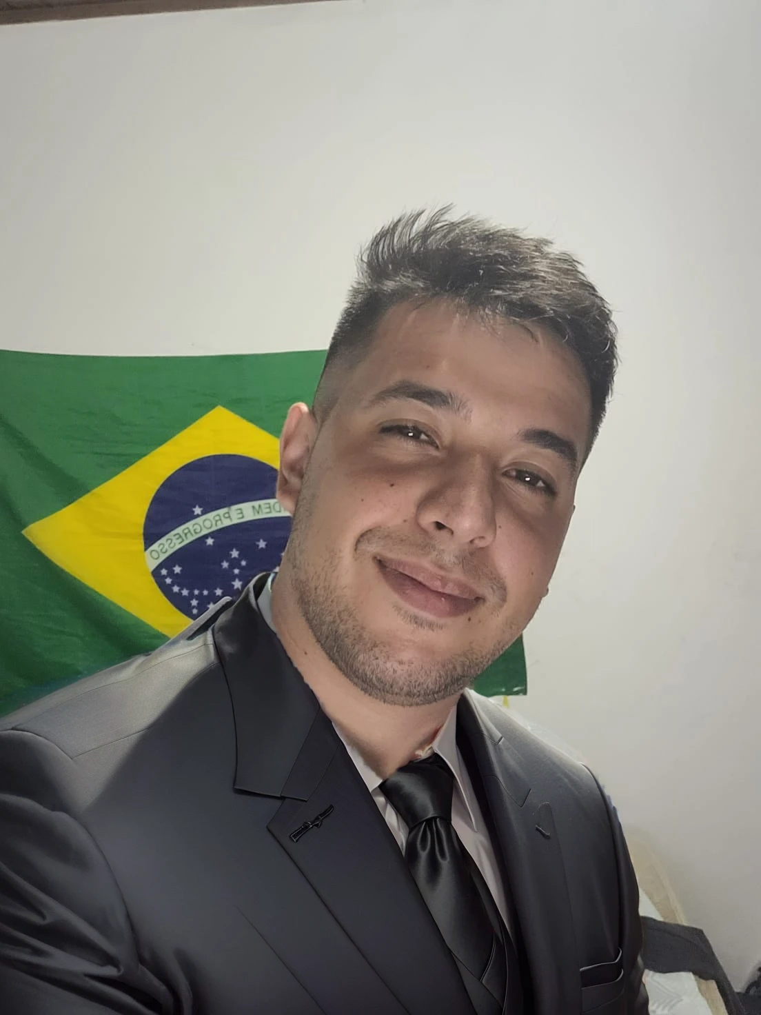 put on a black suit with a tie