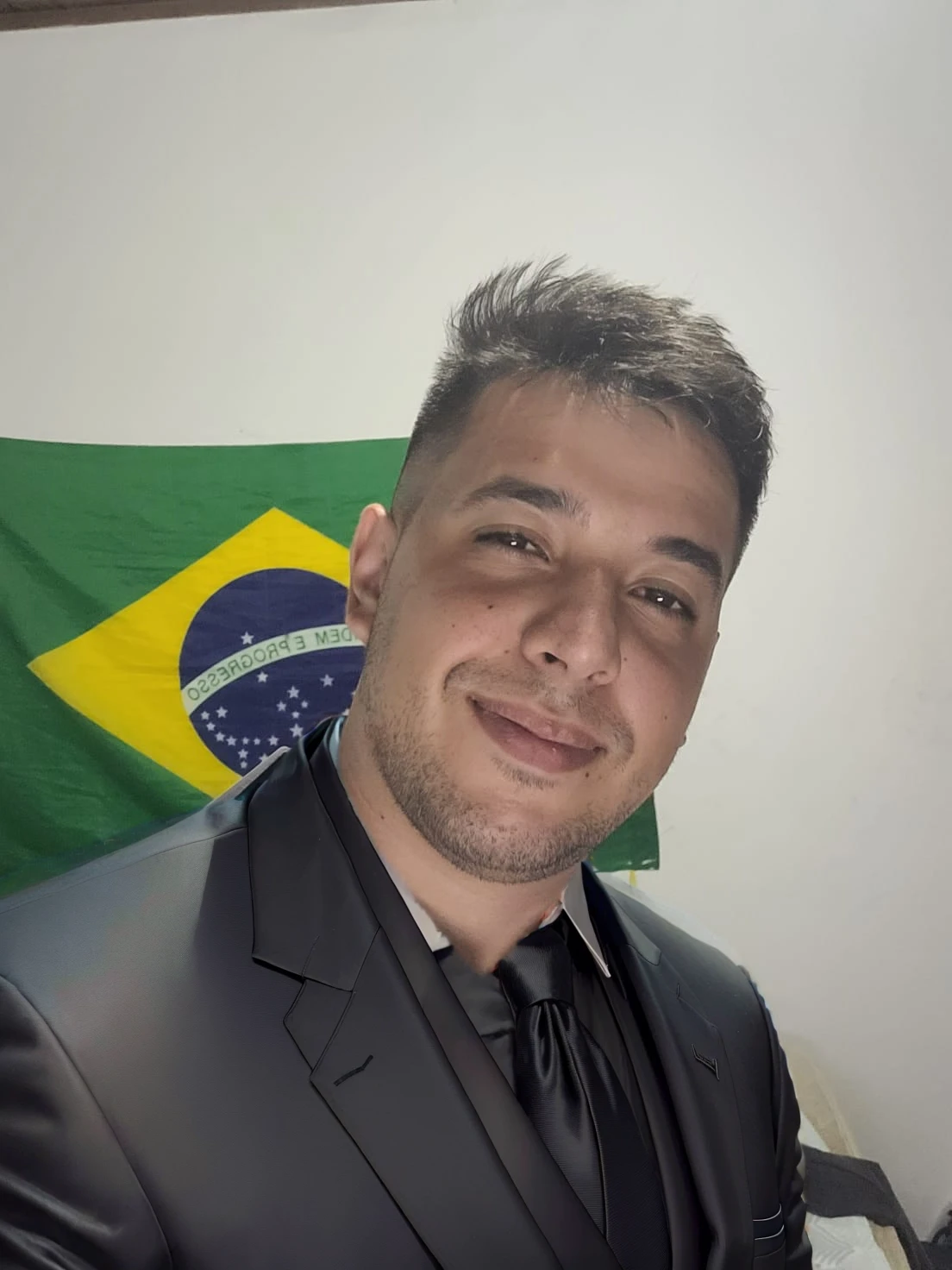 put on a black suit with a black tie