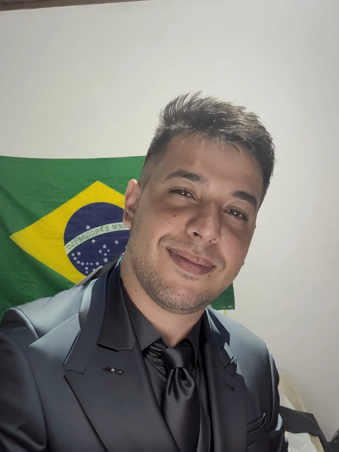 put on a black suit with a black tie