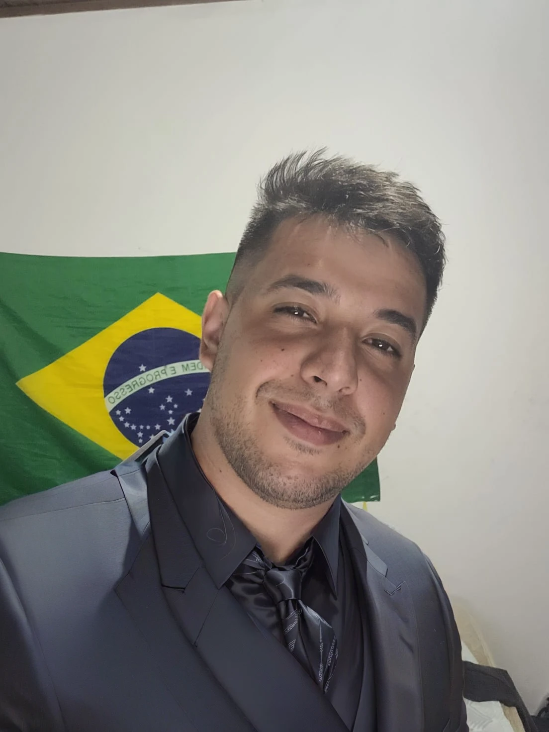 put on a black suit with a black tie