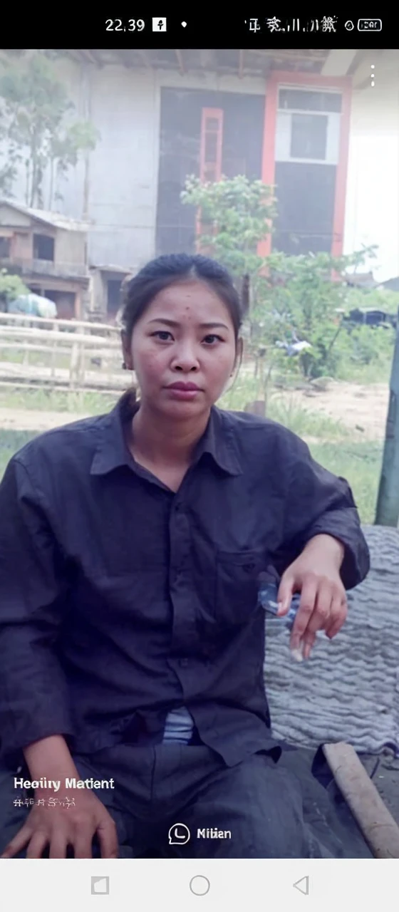 a pregnant woman sits on the ground. scared expression. in front of him is a toy in the shape of a flying kuyang with a fire effect. Wilderness background