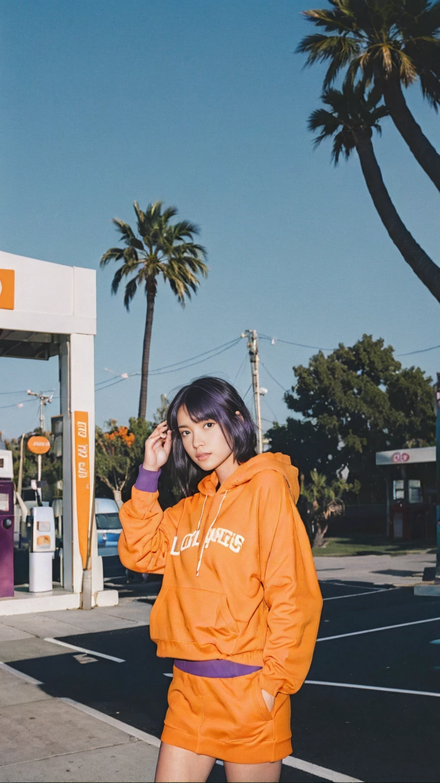 long shot portrait of cute 23 yo girl ,wear ((orange color oversized hoodie)), wear ((purple tennis skirt)),looking viewer,Best Quality,Masterpiece,Ultra High Resolution,(Realisticity:1.4),Original Photo, 1Girl, light leak,ultra high resolution,UHD,beautiful, (black bob hair), almond eye, no makeup, in front of ((80's gas station)), (realistic:1.2), (very detailed:1.1), ((masterpiece)),summer, blue sky, palm trees,sunny, los angles vibes,film camera, 800mm lens,style of Philip Lorca diCorcia