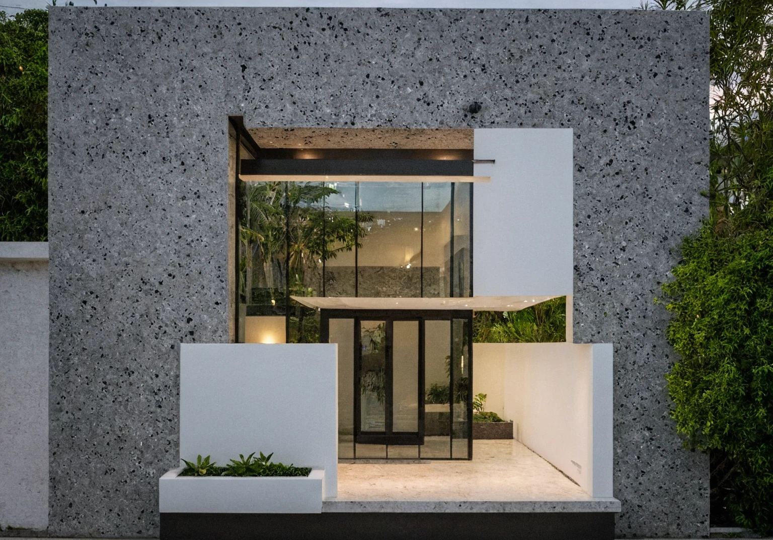 masterpiece, best quality, exterior design, (sunset), one-story modern house in Vietnamese village, marble, steel, modern light-colored granite facade and white walls, wooden ceiling , large glass, modern minimalist style, green shrubs and tropical plants background, large doors and windows.