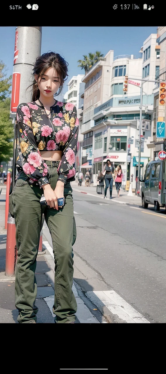 Beautiful woman, fiddling with cell phone in the middle of the street, short clothes