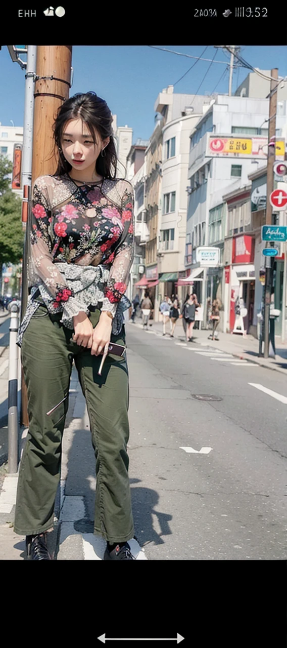 Beautiful woman, fiddling with cell phone in the middle of the street, short clothes
