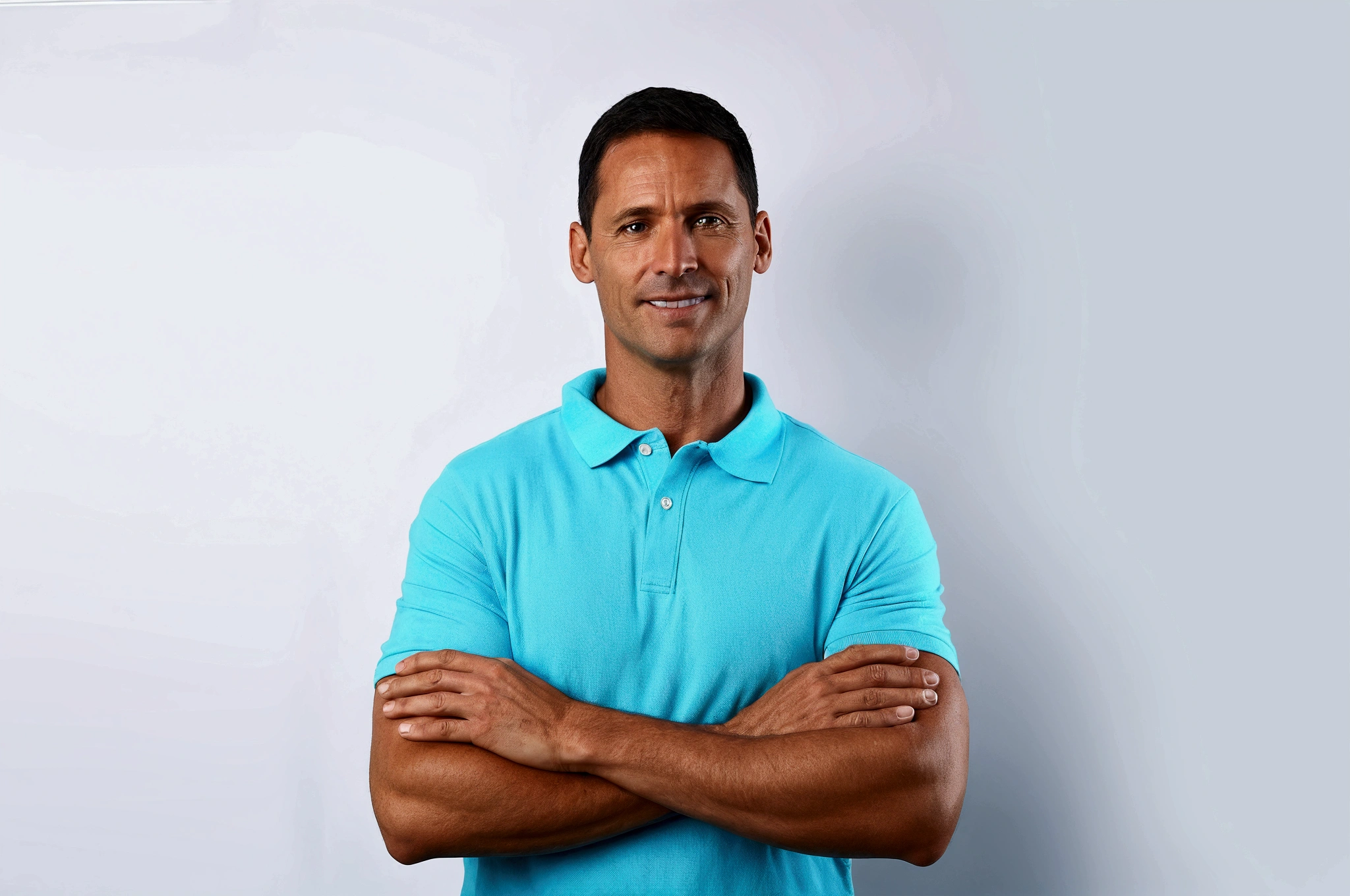 trimmed man in a blue polo shirt standing with his arms crossed, posing with arms crossed, confident relaxed pose, lean man with light tan skin, wearing a light blue shirt, photo of a man, arms crossed on the chest, man in his 40s, midle age man, wearing polo shirt, a photo of a man, athletic man in his 30s