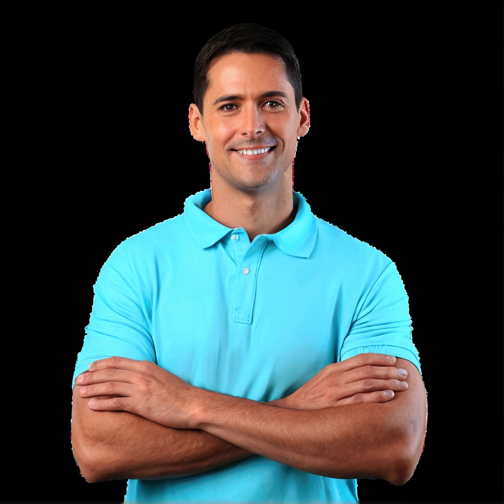 thin man in a blue shirt with his arms crossed and a beautiful smile on his face