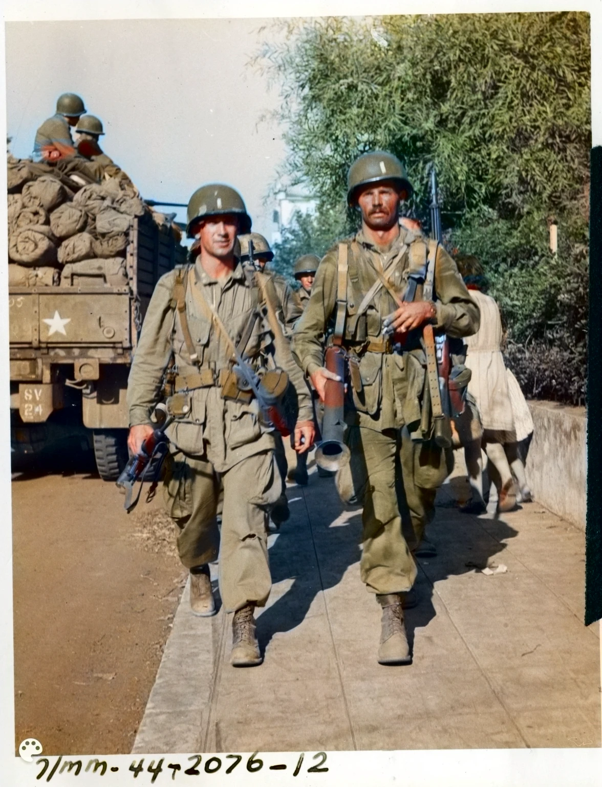 soldiers walking down a path with their weapons in their hands, us soldiers, world war ii military style, ww2 photo, soldiers, korean war, old color photograph, ww2 historical photography, ww 2 historical photography, infantry, wwii, ww2 historical photo, a colorized photo, several soldiers, ww2 era photograph, colorized photograph, ww 2, ww2